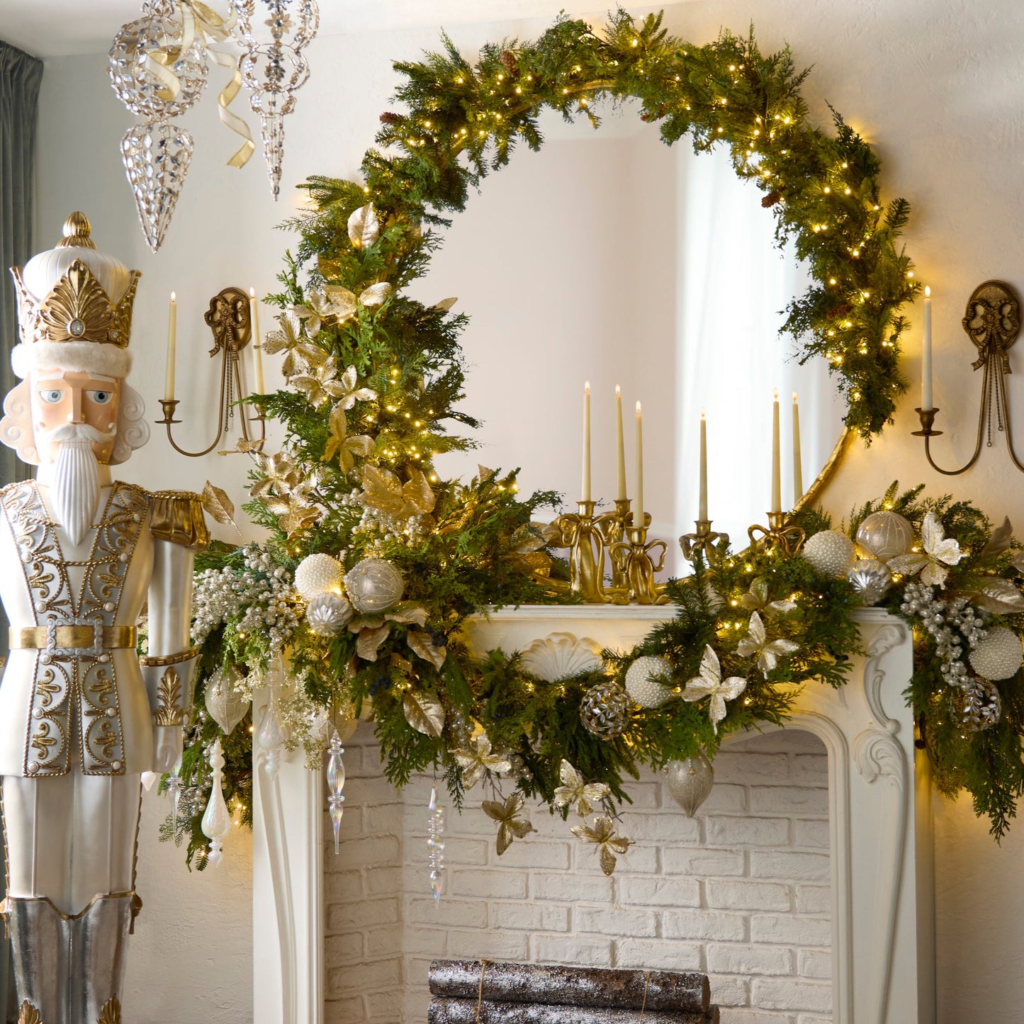 Decorative Christmas wreath with lights and ornaments on a fireplace mantel, nutcracker figure to the left.