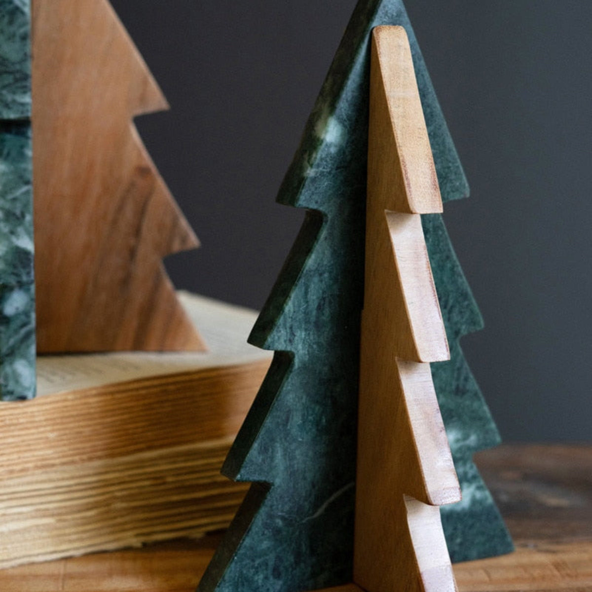 Wooden Christmas trees on a dark background