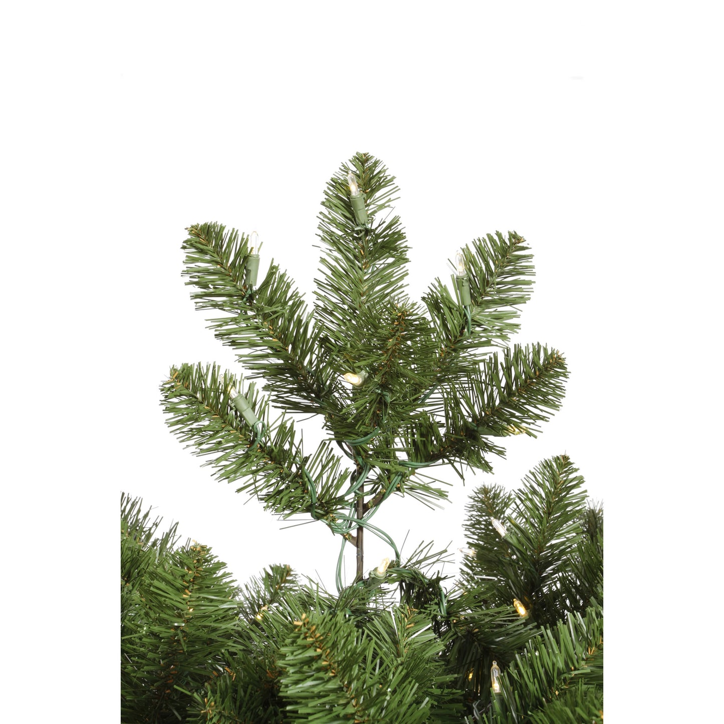 Artificial Christmas tree branch with green needles on a white background