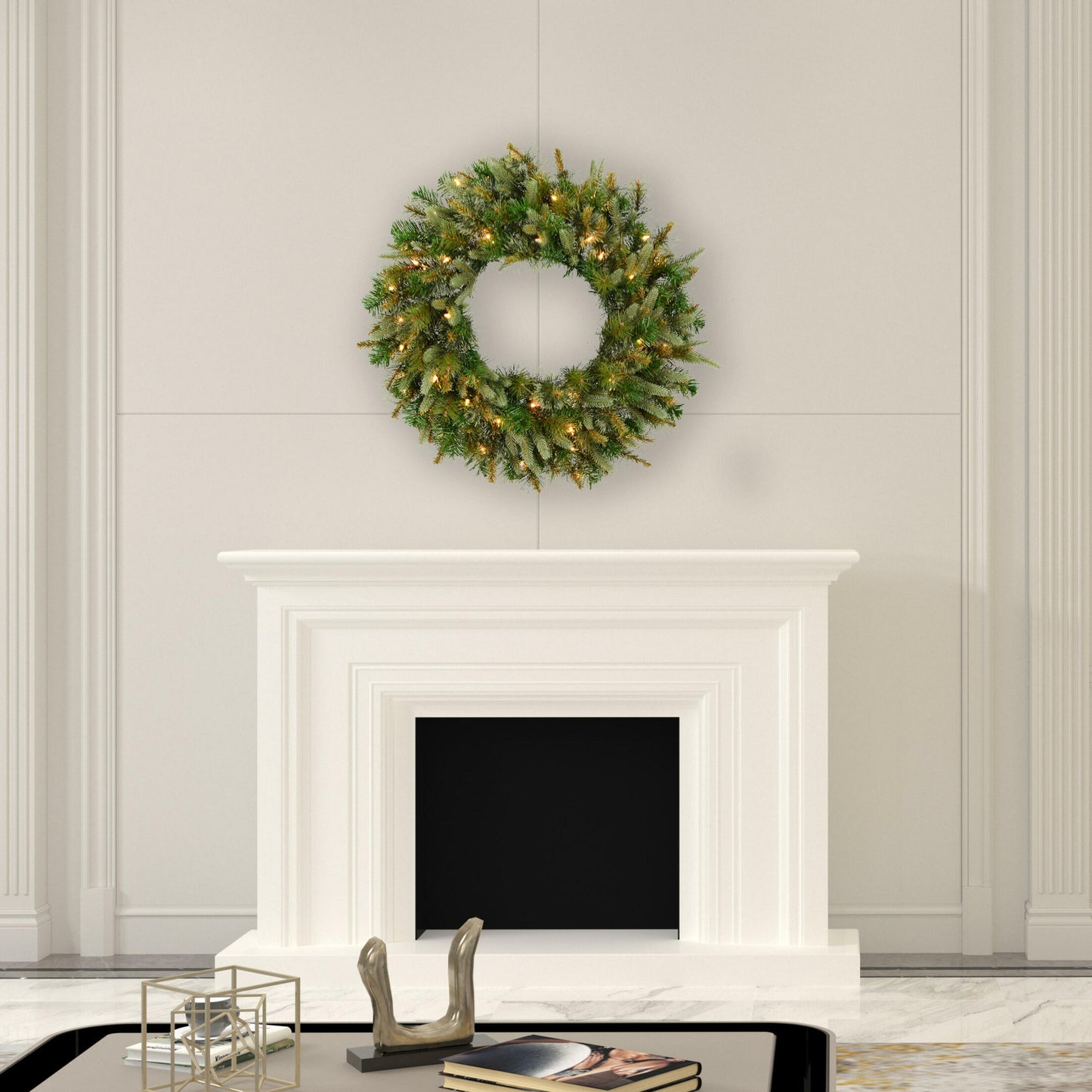 Decorative wreath with lights hanging above a fireplace in a room with light-colored walls.