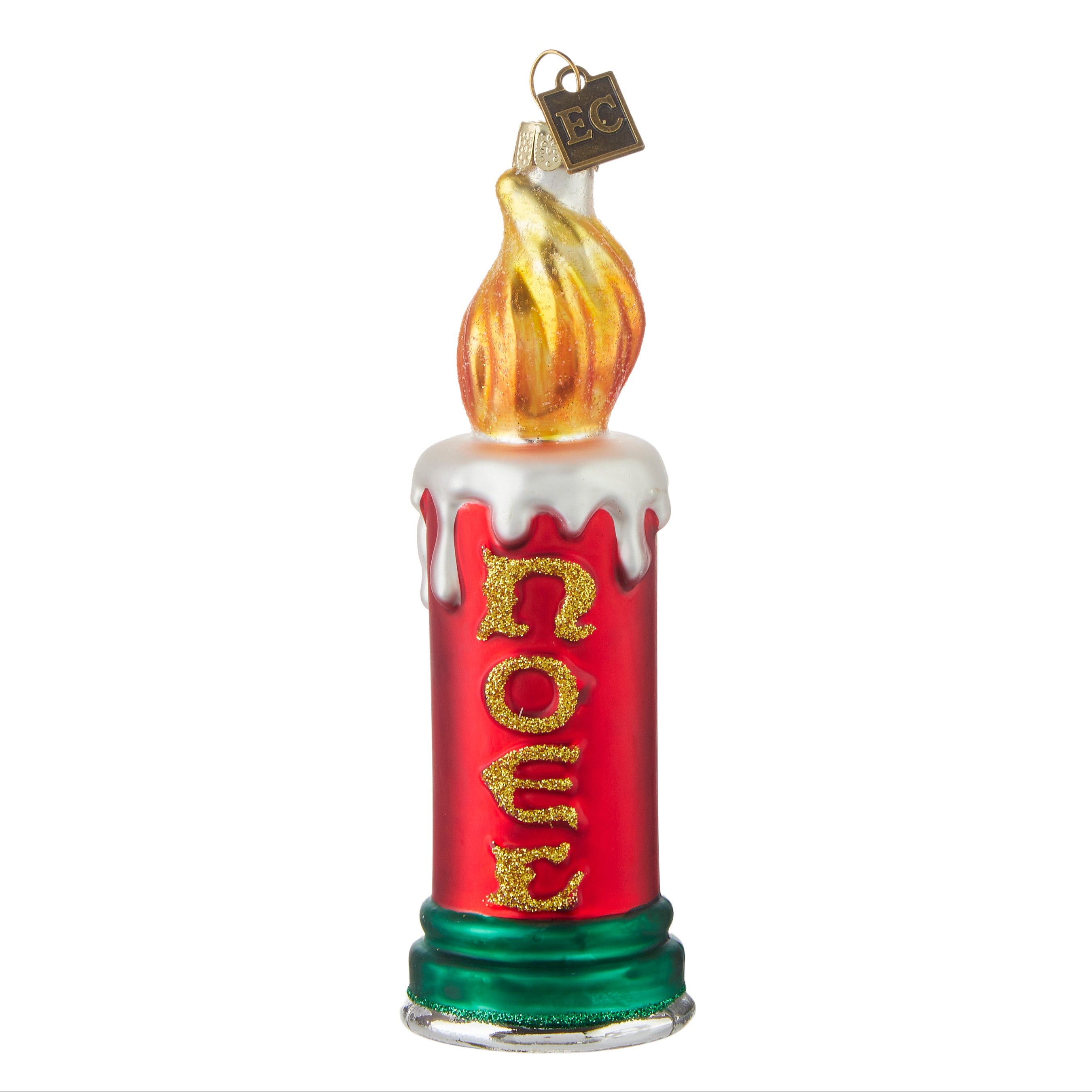 A red glass Christmas ornament with 'Noel' written on it, designed by Eric Cortina, featuring intricate glasswork and a flame-like top.