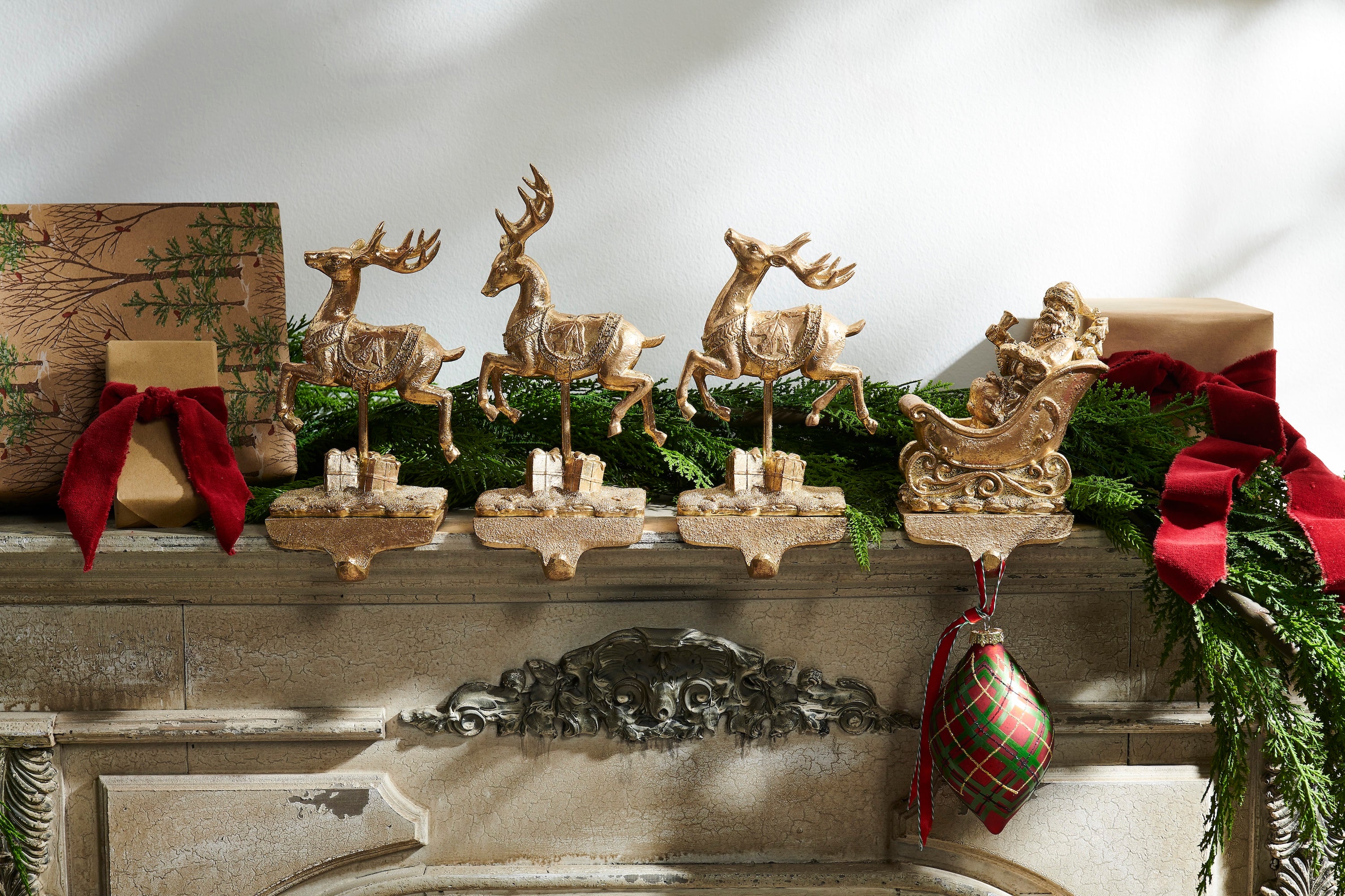 RAZ Imports Santa and Reindeer 10.5" Golden Resin Iron Christmas Stocking Holders, Set of 4