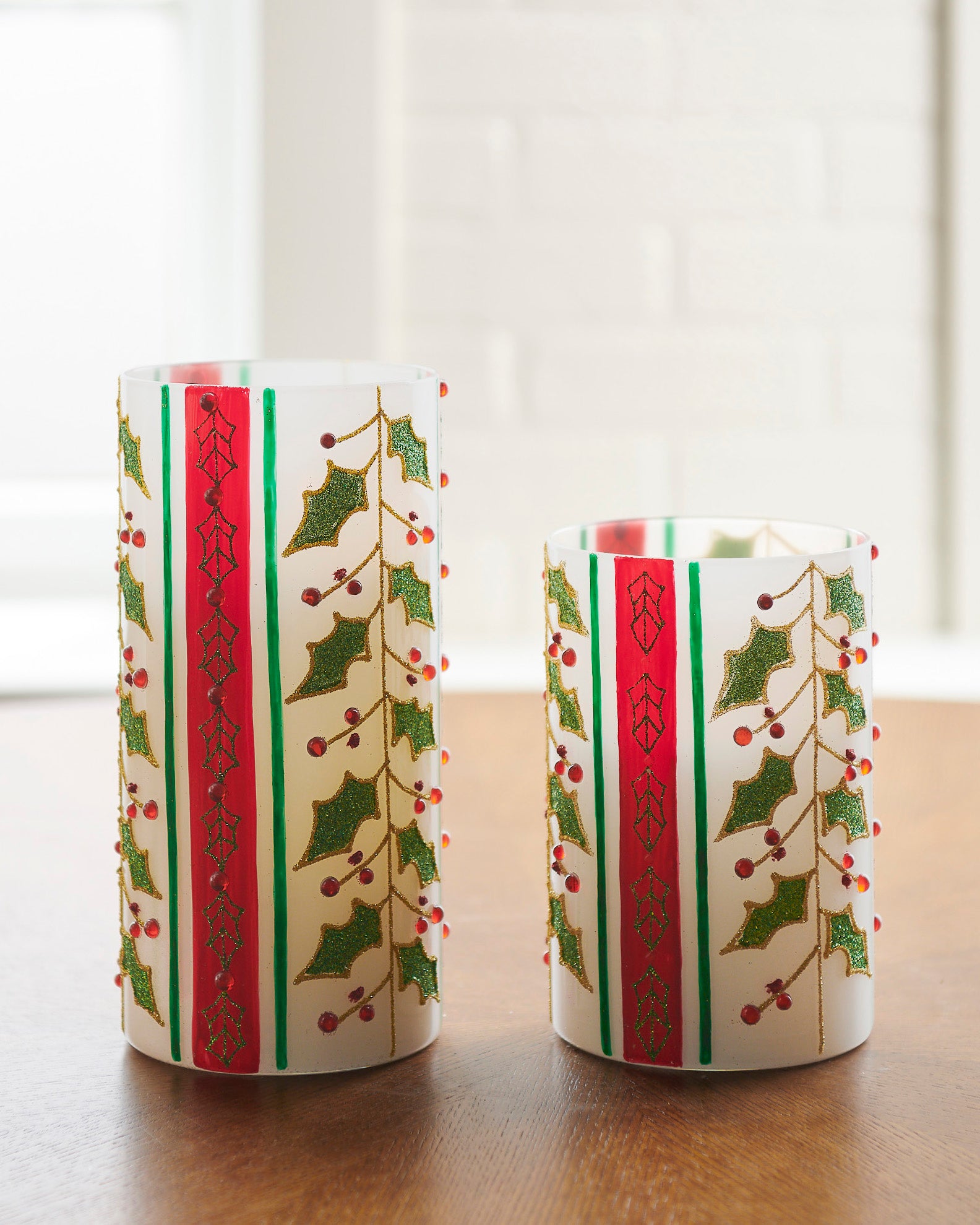 RAZ Imports 8" and 6" Red and Green Holly Berry Striped Traditional Glass Christmas Hurricanes, Set of 2