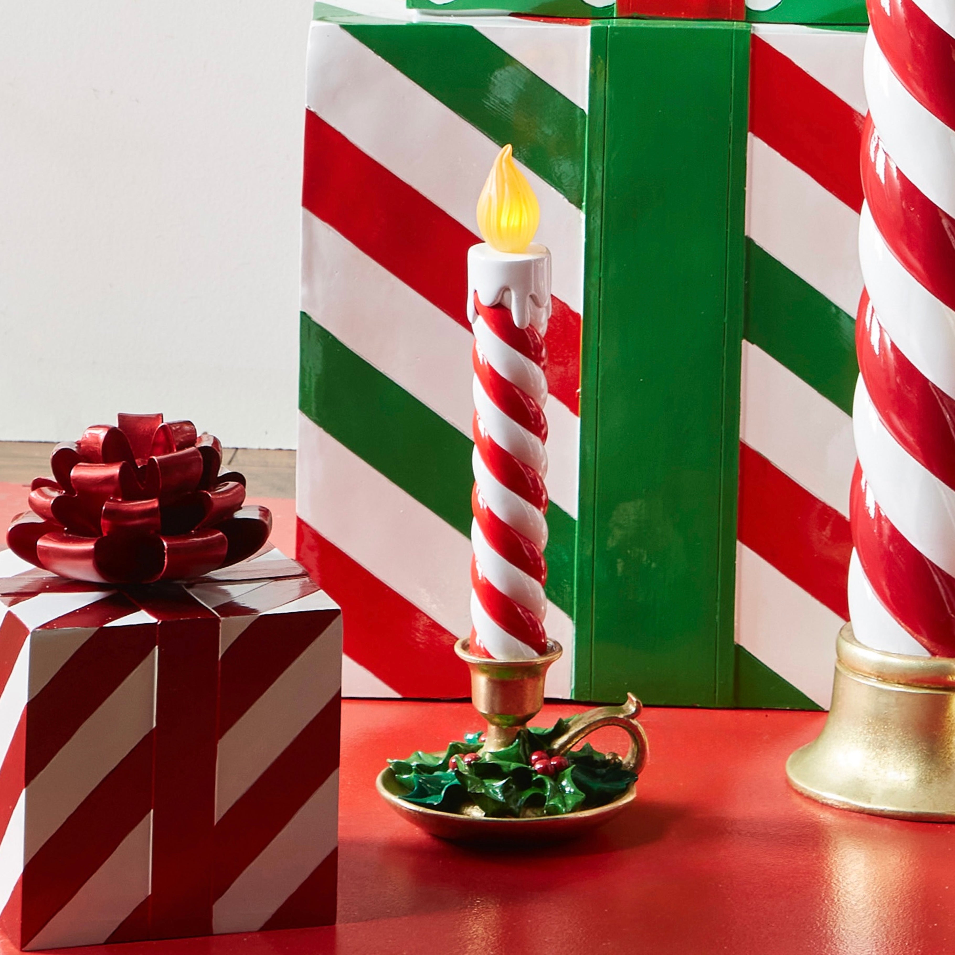 RAZ Imports 17" Red and White Striped Resin Over-Sized Light-Up Vintage Christmas Candle with Holly, Battery-Operated