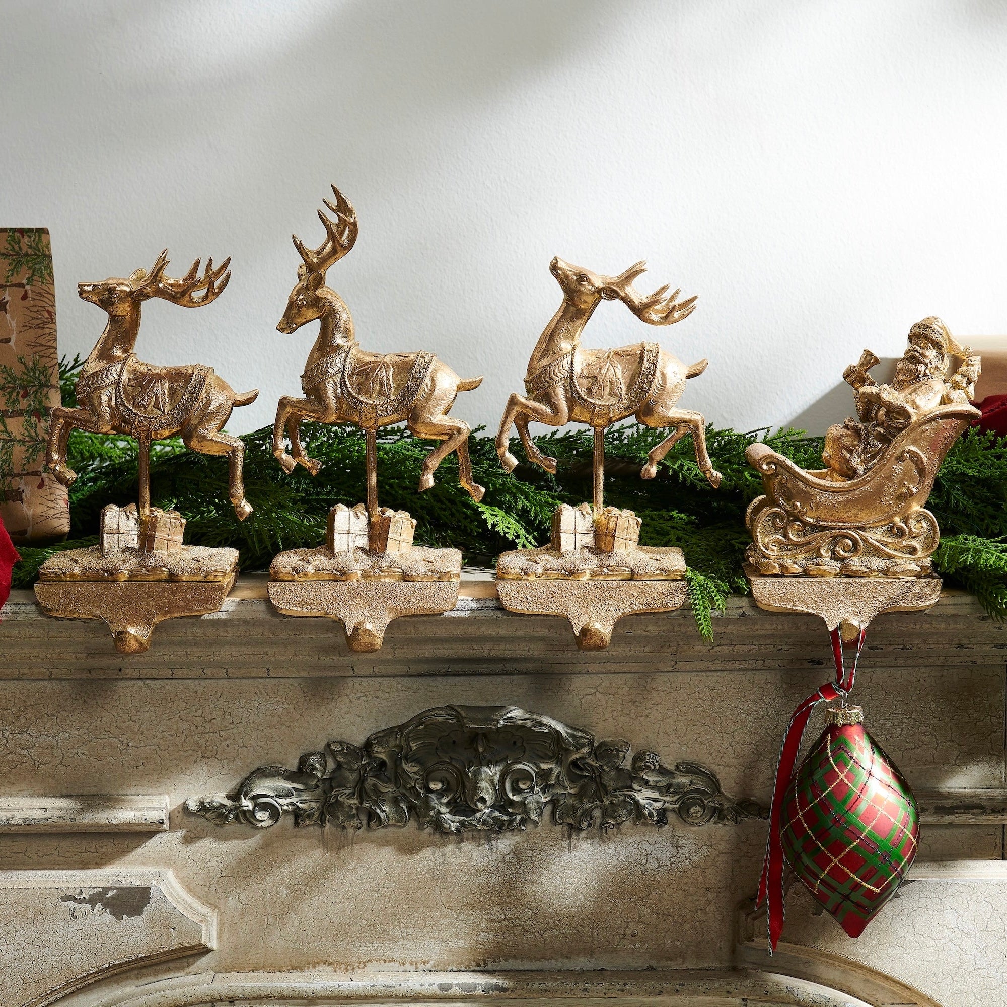 RAZ Imports Santa and Reindeer 10.5" Golden Resin Iron Christmas Stocking Holders - Set of 4