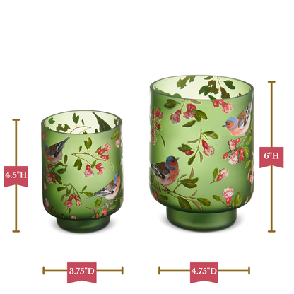Two green glass candle holders with floral and bird design, shown with measurements on a white background.