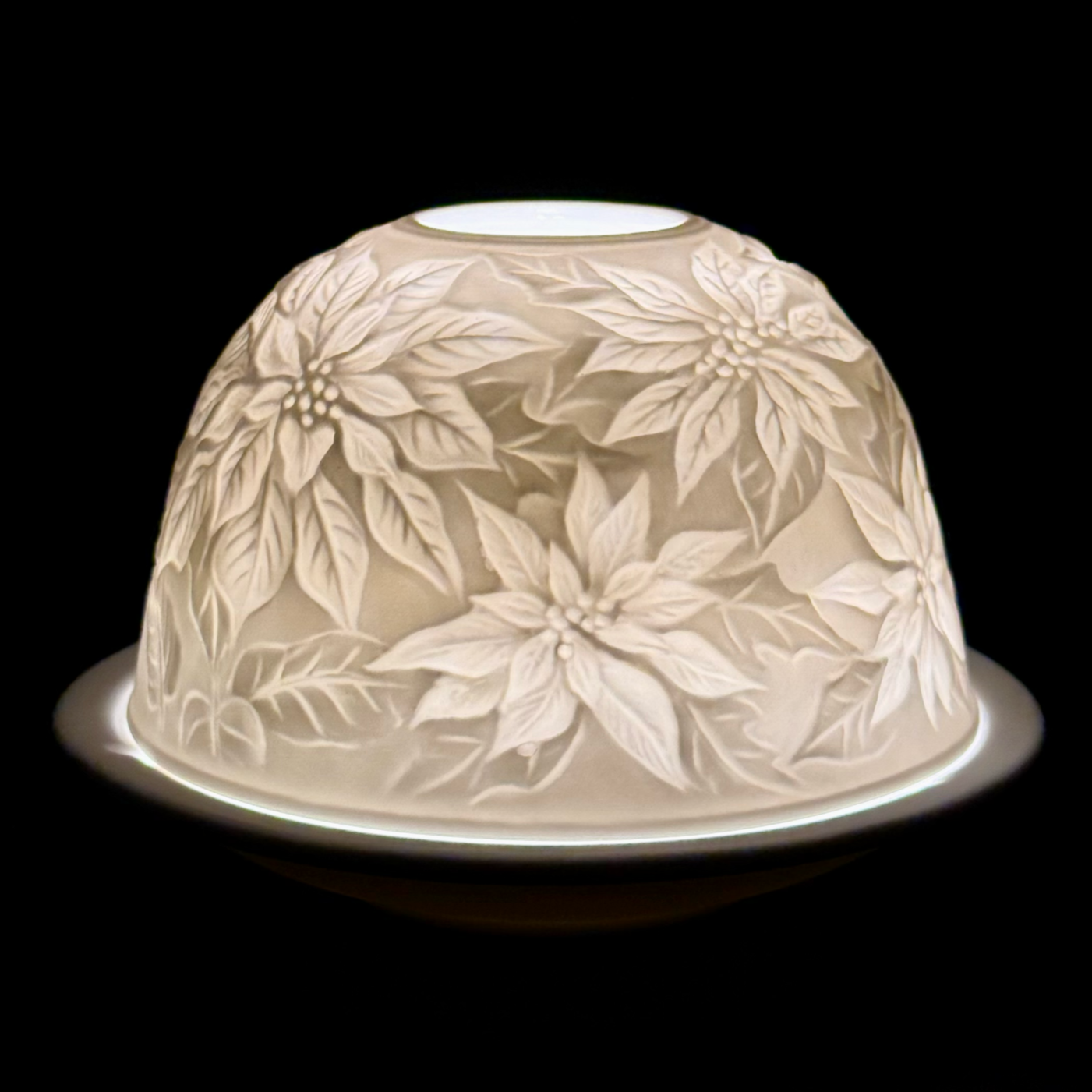 Decorative glass dome with floral pattern on a black background