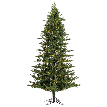 Pre-lit artificial Christmas tree with lights on a white background